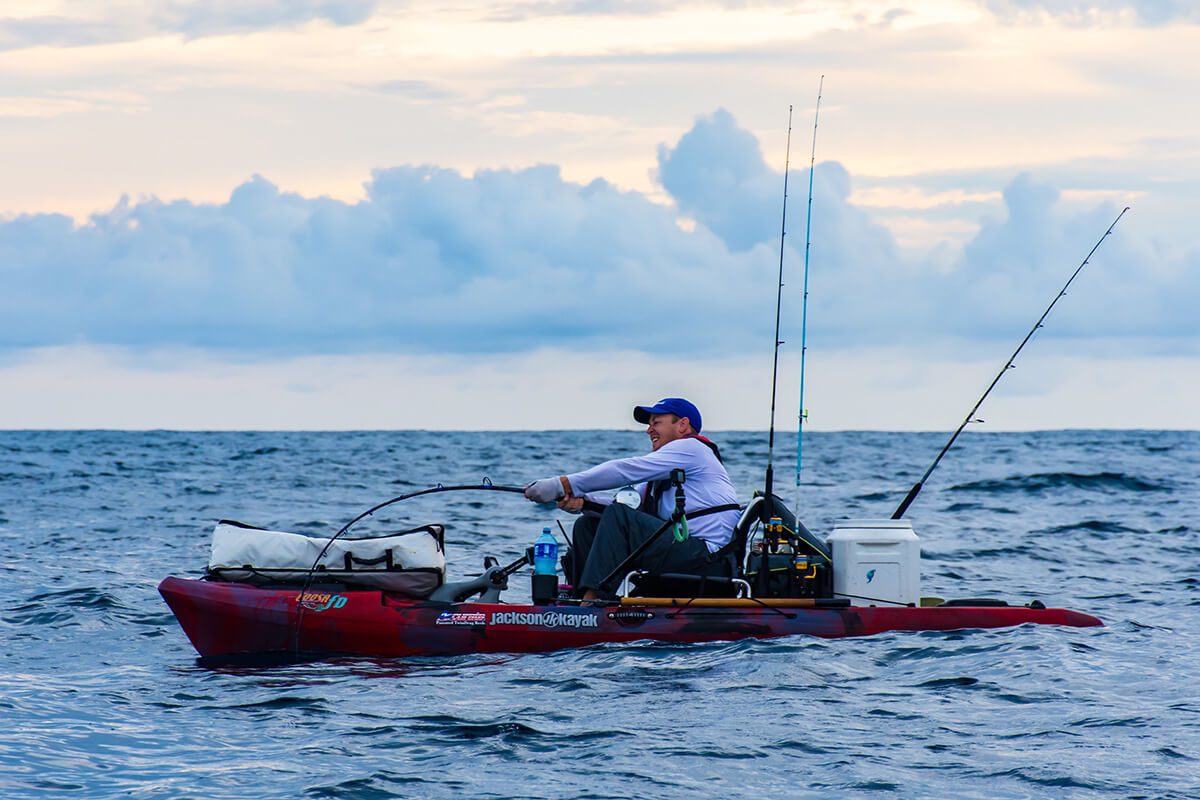 kayak angler adam fisk being pulled by a large fish